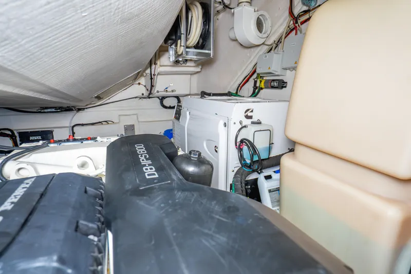 Slide: The Image of Engine room of 2021 Azimut Atlantis 51 yacht, showcasing mechanical components and wiring. - 81