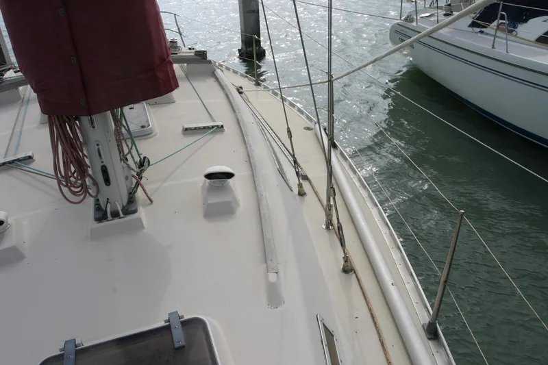 Slide: The Image of Deck view of 1983 Beneteau Idylle 11.50 sailboat docked in marina. - 12