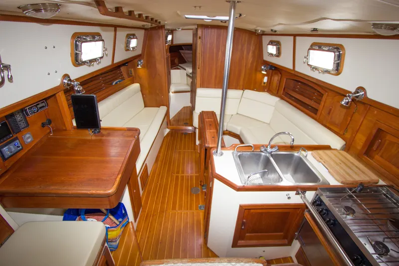 Slide: The Image of Interior of 1992 Pacific Seacraft Cutter sailboat with wood finish and modern amenities. - 11