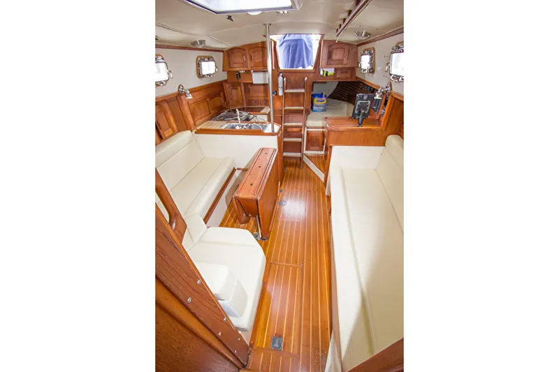 Slide: The Image of Interior of 1992 Pacific Seacraft Cutter sailboat with wooden finish and seating area. - 15