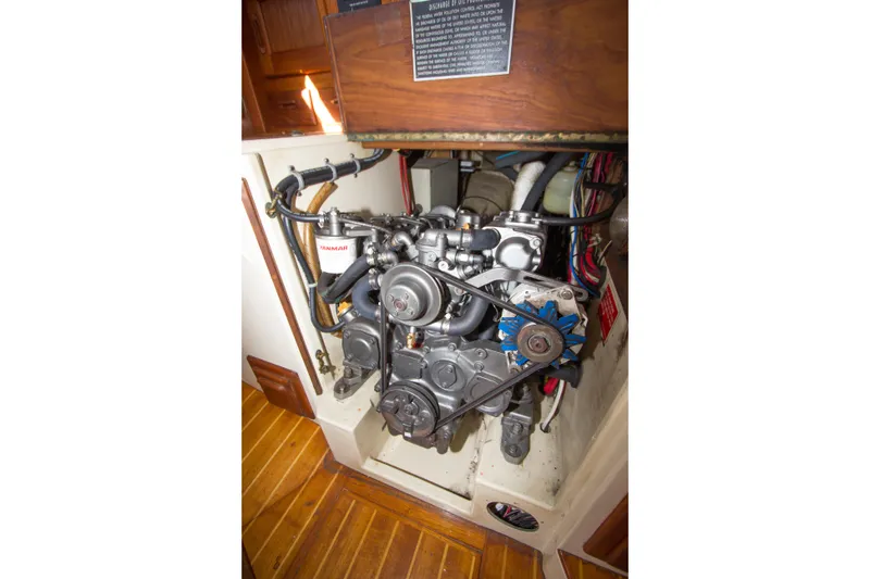 Slide: The Image of Engine compartment of a 1992 Pacific Seacraft 37 sloop, featuring a Yanmar engine. - 33