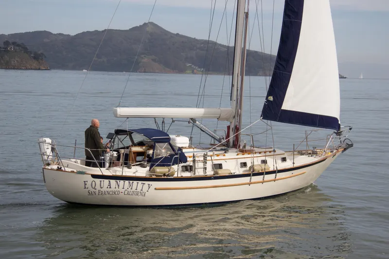 Slide: The Image of 1992 Pacific Seacraft 37 sloop sailing near San Francisco, California, with scenic mountain backdrop. - 4