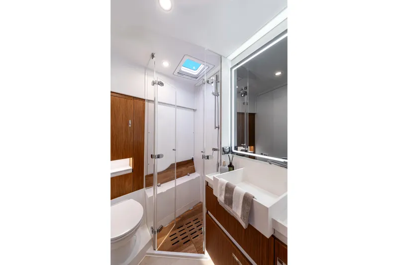 Slide: The Image of Luxurious bathroom in 2026 Moody 48 Deck Saloon yacht, featuring modern fixtures and elegant wood accents. - 29