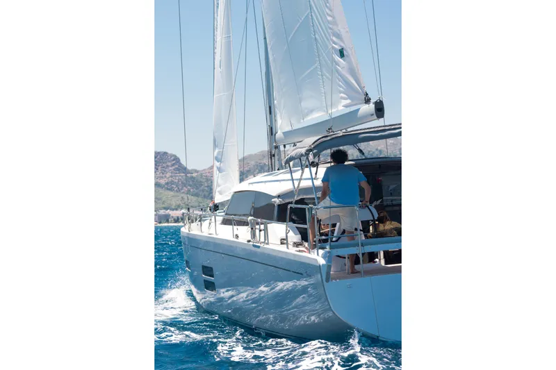 Slide: The Image of Sailing on a 2026 Moody 48 Deck Saloon yacht in clear blue waters. - 6