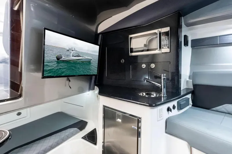Slide: The Image of 2027 Deep Impact 399 Fwd Cabin interior with modern amenities and sleek design. - 16