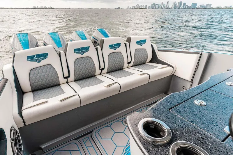 Slide: The Image of Luxury seating on 2027 Deep Impact 399 Fwd Cabin boat with ocean view. - 20