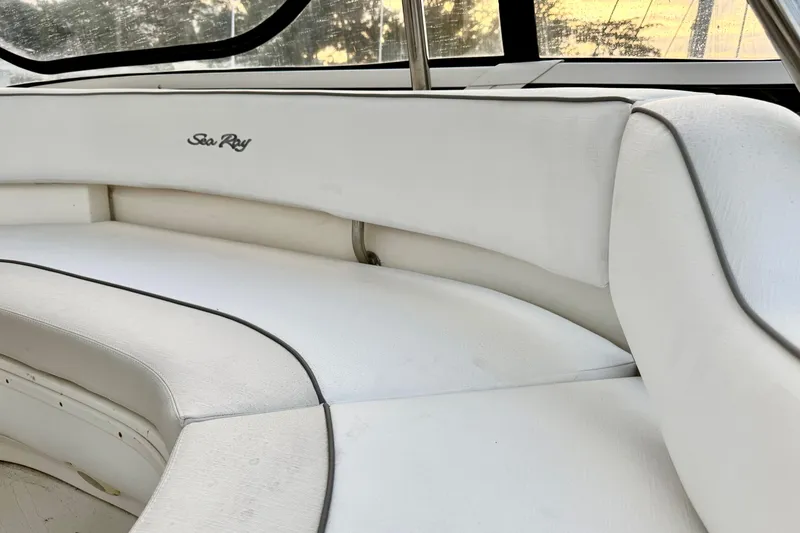 Slide: The Image of White seating area on a 1999 Sea Ray 560 Sedan Bridge yacht. - 11