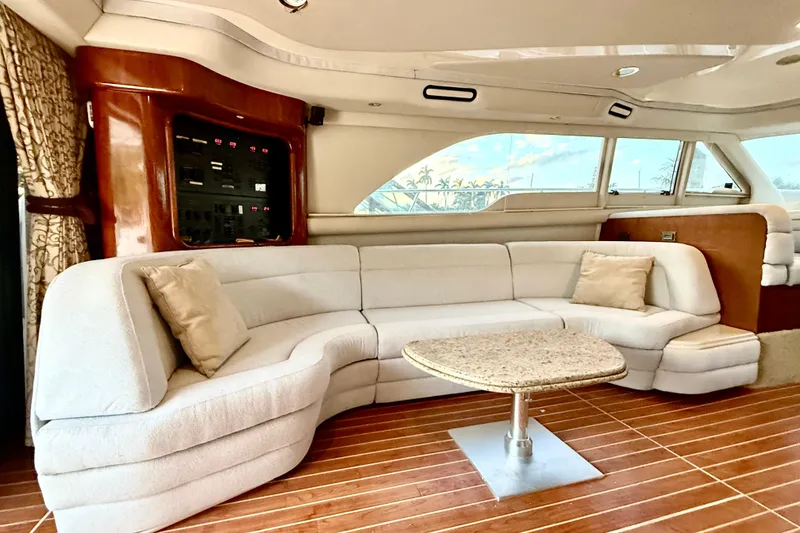 Slide: The Image of Luxurious interior of a 1999 Sea Ray 560 Sedan Bridge yacht with plush seating and elegant decor. - 14
