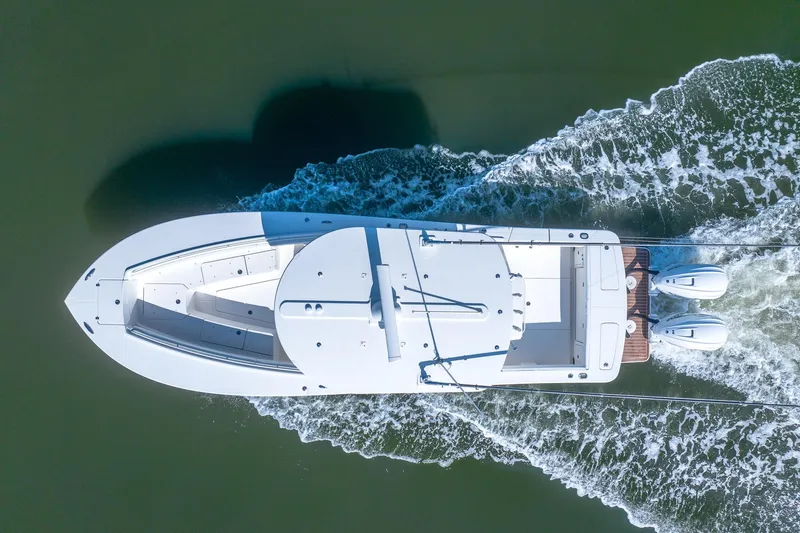 Slide: The Image of Aerial view of 2021 Regulator 31 boat cruising on water. - 11