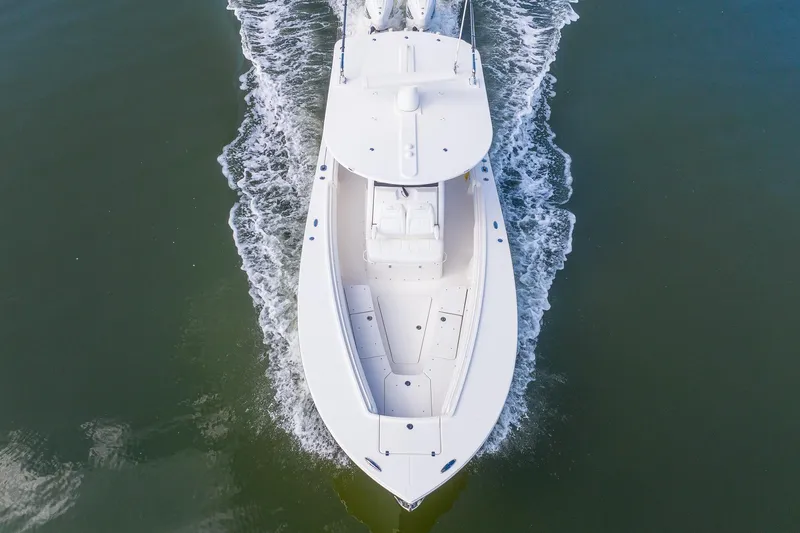 Slide: The Image of Aerial view of 2021 Regulator 31 boat cruising on water. - 12