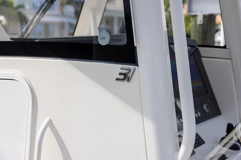 Slide: The Image of 2021 Regulator 31 boat console with sleek design and modern controls. - 25