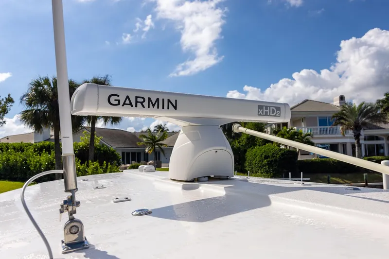 Slide: The Image of 2021 Regulator 31 boat with Garmin xHD2 radar, clear sky background. - 28