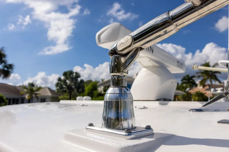 Slide: The Image of Close-up of a 2021 Regulator 31 boat's polished metal fitting under a blue sky. - 29