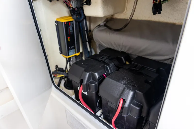 Slide: The Image of 2021 Regulator 31 boat battery compartment with wiring and charger. - 37