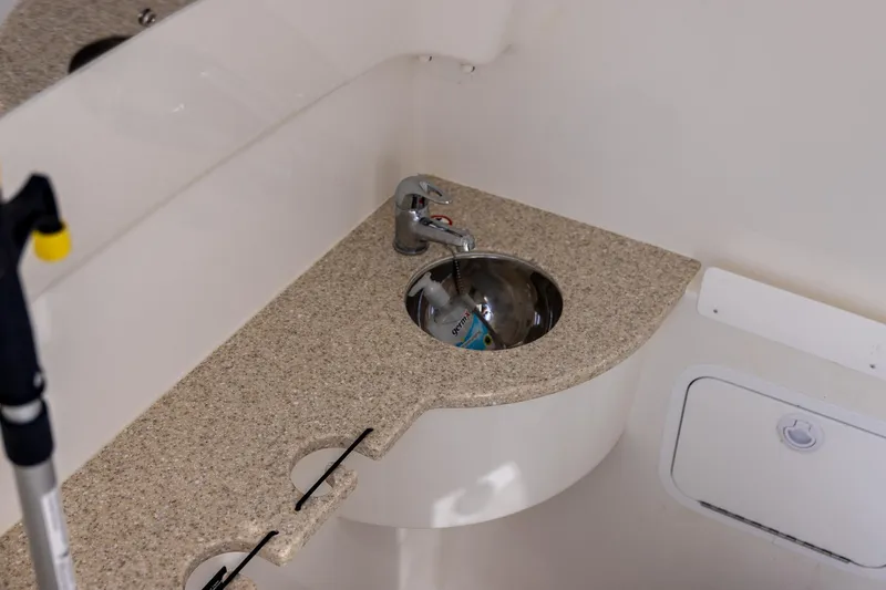 Slide: The Image of 2021 Regulator 31 boat interior with compact sink and countertop. - 38