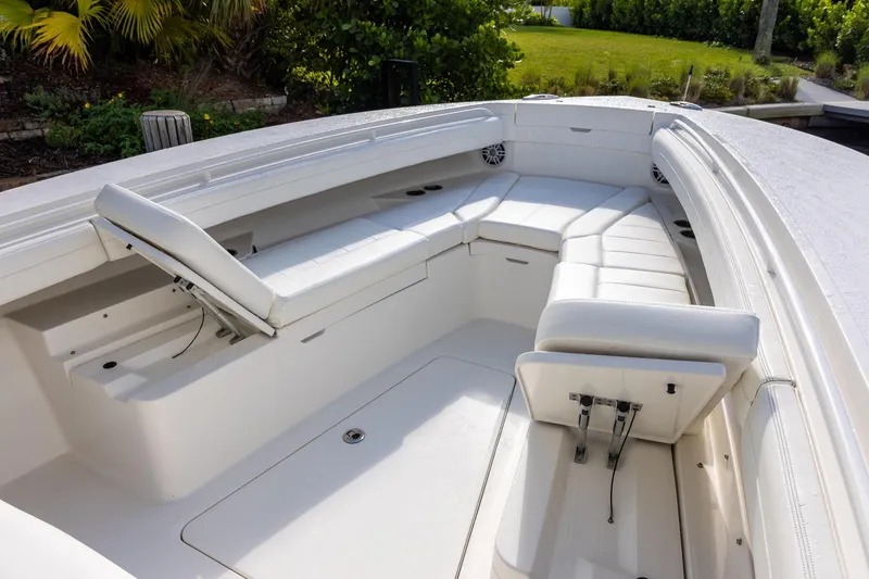 Slide: The Image of 2021 Regulator 31 boat interior with white seating and adjustable backrests. - 42