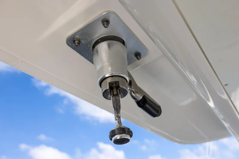 Slide: The Image of Close-up of a 2021 Regulator 31 boat handle against a blue sky background. - 48