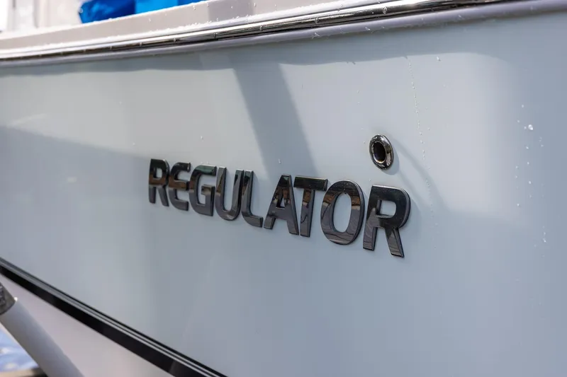 Slide: The Image of 2021 Regulator 31 boat with sleek lettering on the hull. - 54
