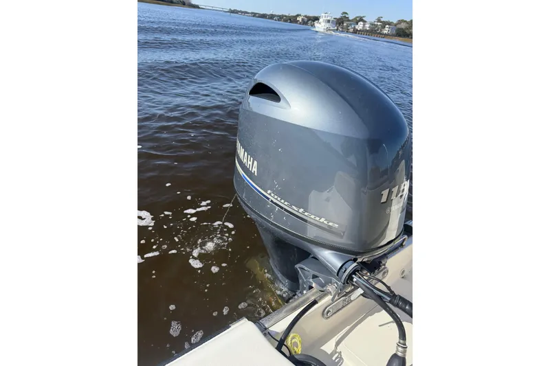 Slide: The Image of 2021 Key West 189 FS boat with Yamaha outboard motor on a calm river. - 15