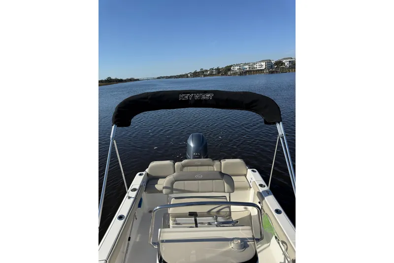 Slide: The Image of 2021 Key West 189 FS boat on calm water with clear blue sky. - 4