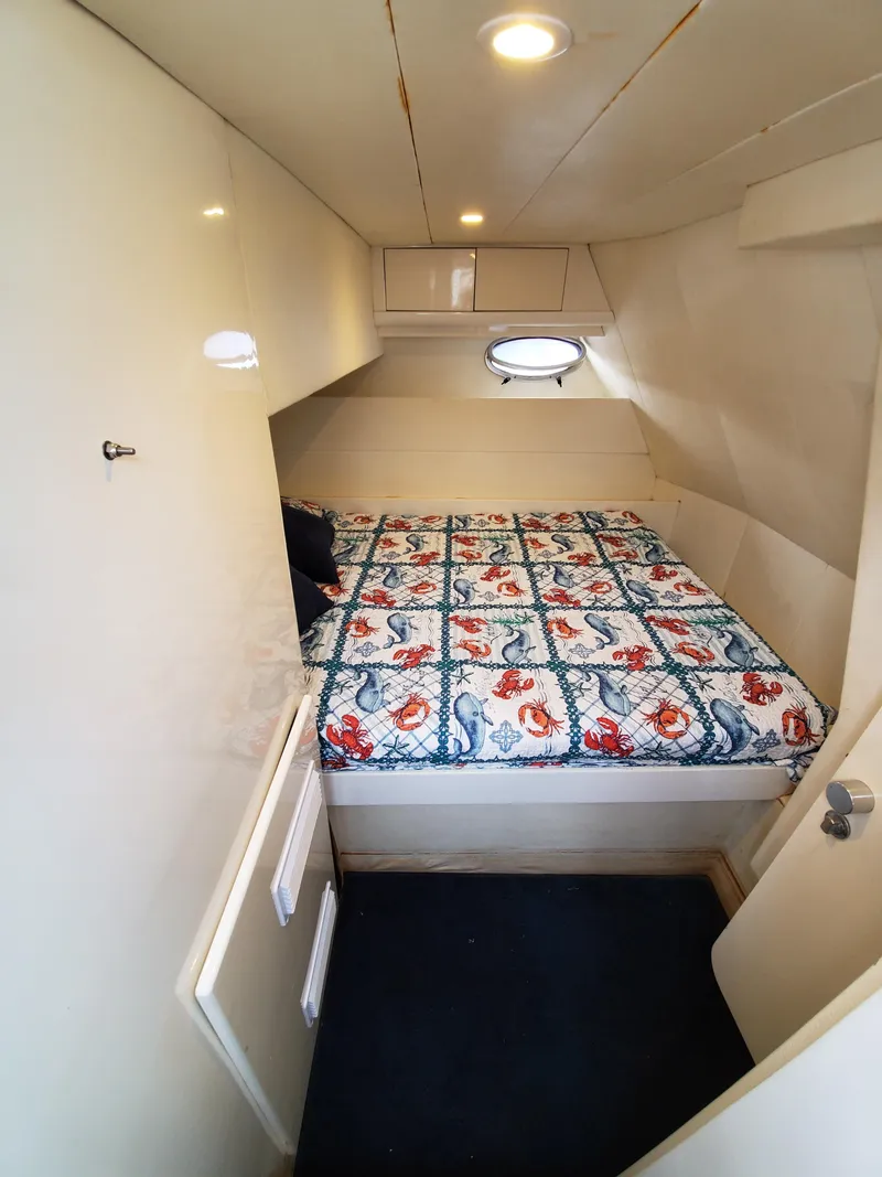 Slide: The Image of Cozy cabin interior of 1993 Giorgi 46 yacht with floral bedspread. - 30