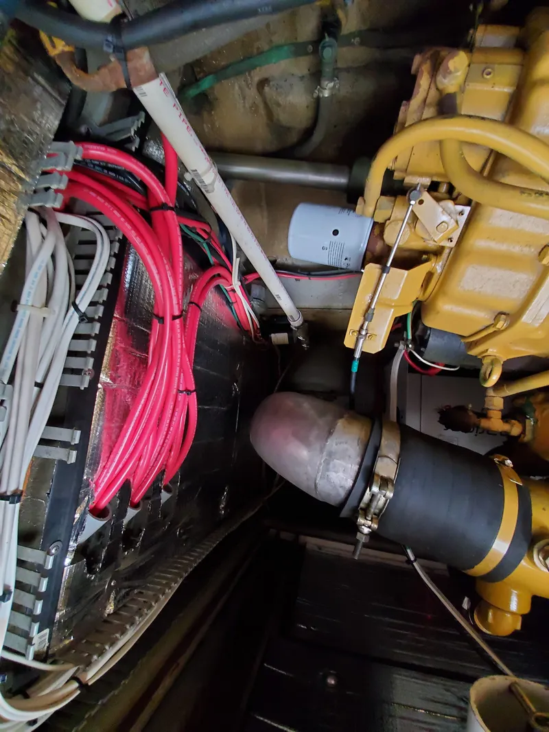 Slide: The Image of Engine compartment of a 1993 Giorgi 46 with wiring and mechanical components. - 43