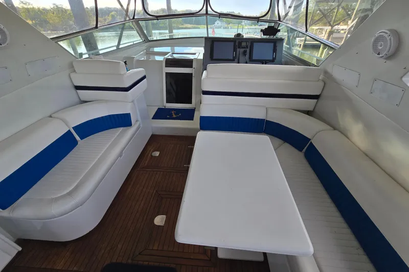 Slide: The Image of Interior of a 1993 Giorgi 46 yacht with white and blue seating. - 88