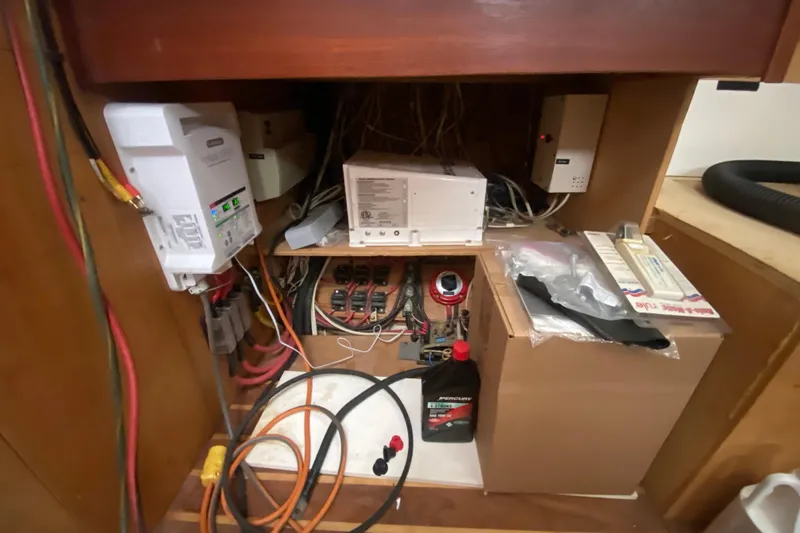 Slide: The Image of Electrical system inside a 1966 Vanguard Bermudian Sloop, featuring wiring and equipment. - 12