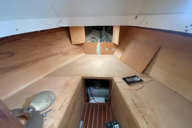 Slide: The Image of Interior of a 1966 Vanguard Bermudian Sloop with wooden panels and nautical equipment. - 15