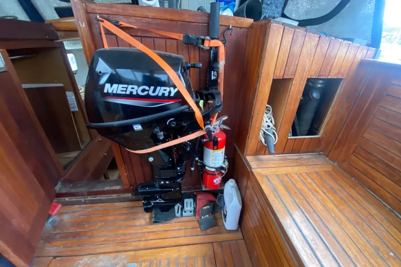 Slide: The Image of 1966 Vanguard Bermudian Sloop interior with Mercury engine and fire extinguisher. - 21