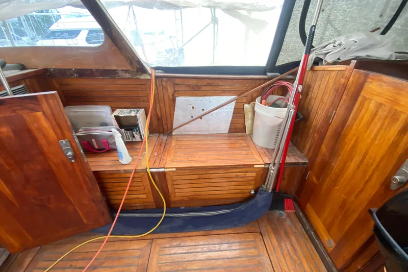 Slide: The Image of Interior of 1966 Vanguard Bermudian Sloop with wooden paneling and nautical equipment. - 24