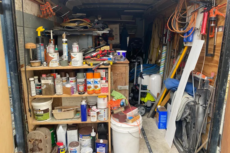 Slide: The Image of Organized workshop with tools, paint cans, and equipment in a Vanguard Bermudian Sloop, 1966. - 29