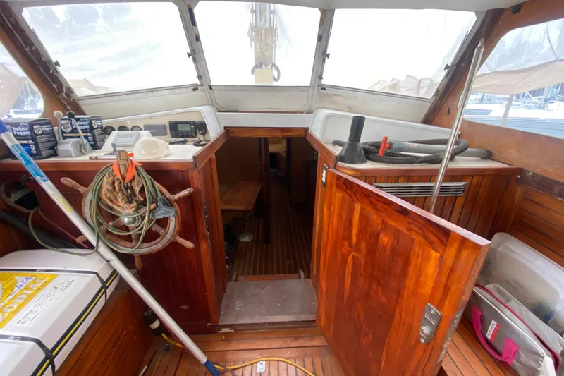 Slide: The Image of Interior of a 1966 Vanguard Bermudian Sloop with wooden finish and nautical equipment. - 7