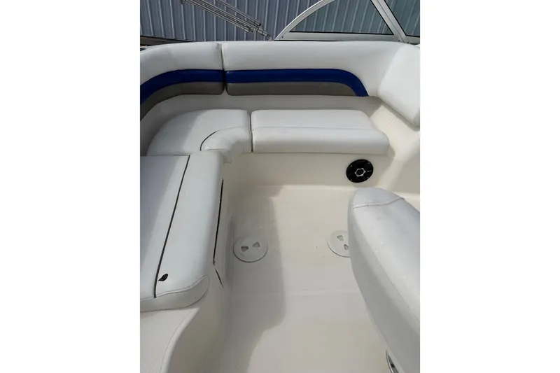 Slide: The Image of 2012 Hurricane SunDeck 187 OB boat interior with white and blue seating. - 13