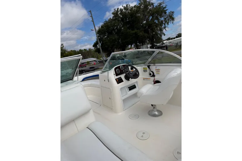 Slide: The Image of 2012 Hurricane SunDeck 187 OB boat interior with steering wheel and seating. - 15