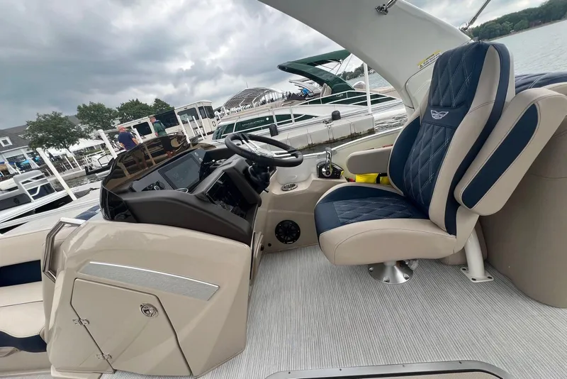 Slide: The Image of Luxurious interior of 2026 Bennington 25 RTFBA boat with plush seating and modern controls. - 10