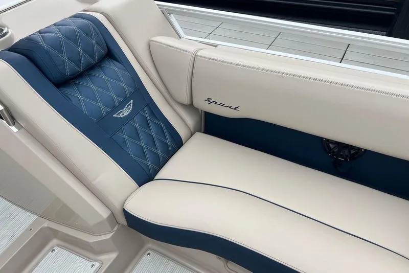 Slide: The Image of Luxurious seating in 2026 Bennington 25 RTFBA boat, featuring blue and beige upholstery. - 3