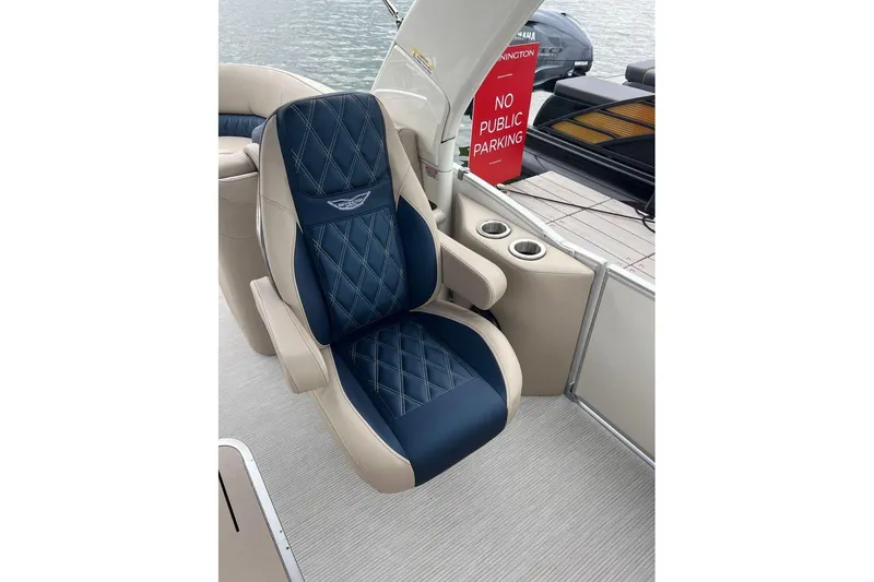 Slide: The Image of Luxurious seating on 2026 Bennington 25 RTFBA boat, featuring blue and beige upholstery. - 9