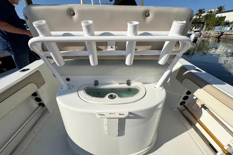 Slide: The Image of 2015 NauticStar 2500XS Offshore boat with rod holders and livewell on deck. - 9