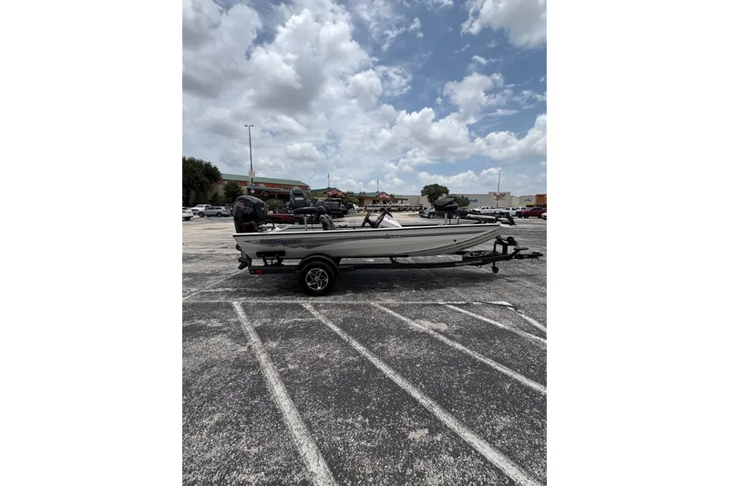 Slide: The Image of 2026 Ranger RT188C boat on trailer in parking lot under cloudy sky. - 6