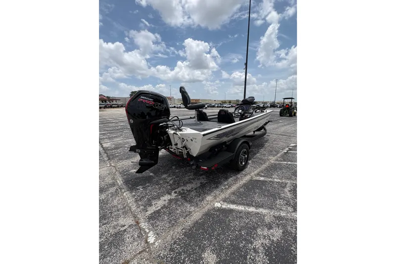 Slide: The Image of 2026 Ranger RT188C boat with Mercury Pro XS engine in parking lot under cloudy sky. - 5