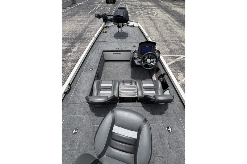 Slide: The Image of 2026 Ranger RT188C fishing boat interior with steering console and seating. - 3