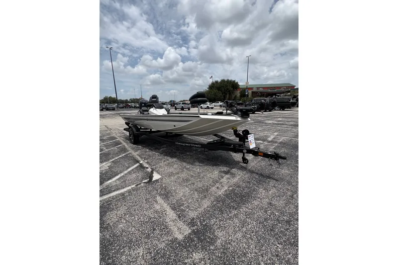 Slide: The Image of 2026 Ranger RT188C boat on trailer in parking lot under cloudy sky. - 4