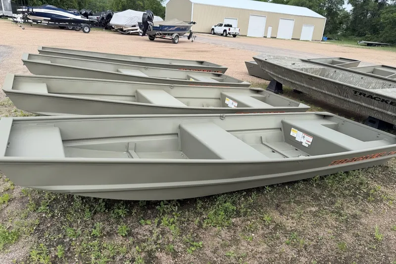 The Image of Row of 2026 Tracker Grizzly 14 Jon boats on display outdoors. - 0