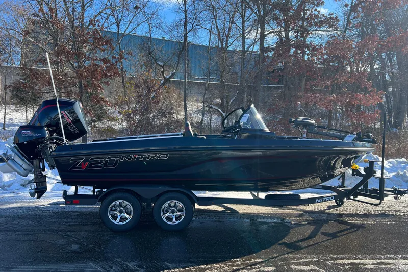 The Image of 2026 Nitro ZV20 boat on trailer, parked on snowy road with trees in background. - 0