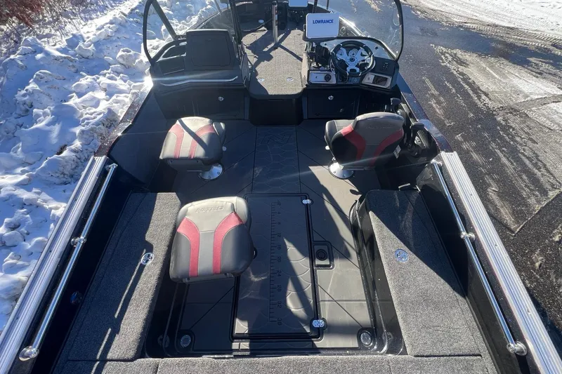 Slide: The Image of 2026 Nitro ZV20 boat interior with red and black seats, snowy background. - 7