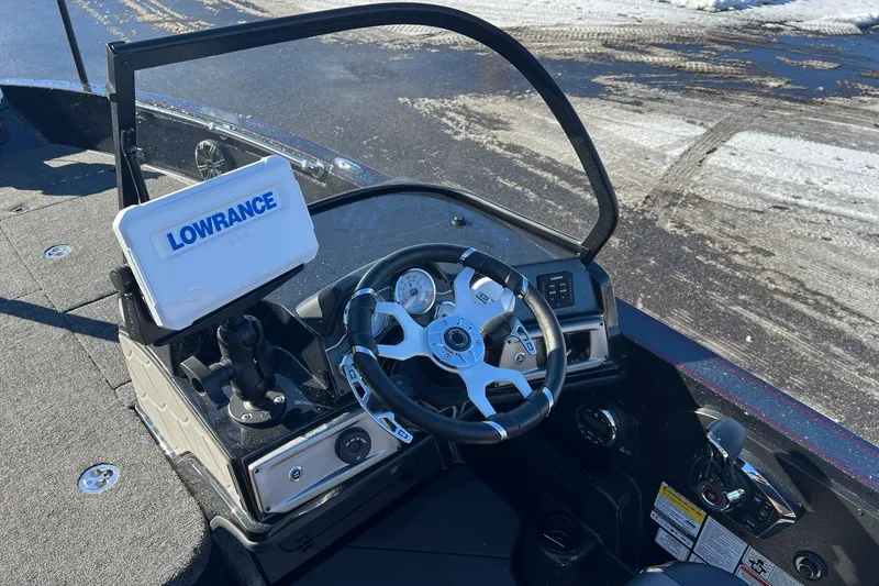 Slide: The Image of 2026 Nitro ZV20 boat dashboard with Lowrance navigation system and steering wheel. - 8