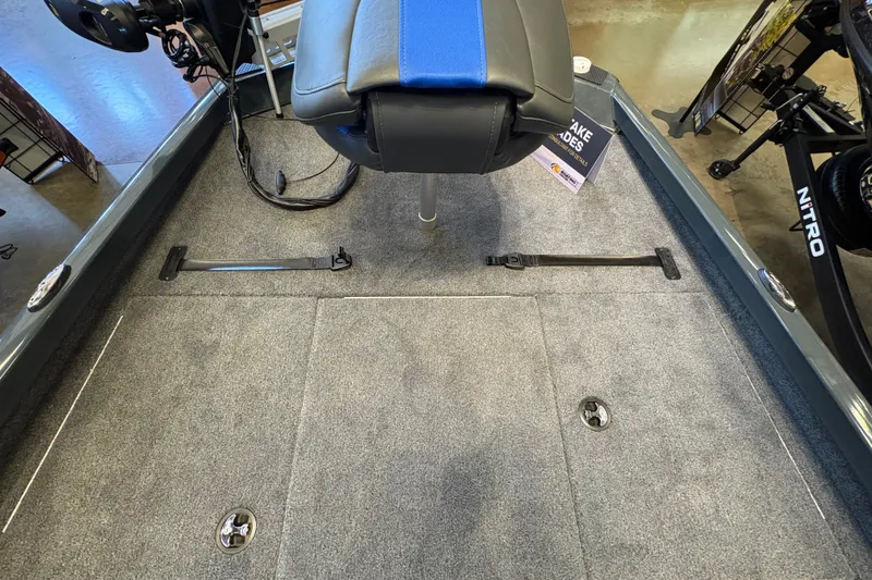 Slide: The Image of 2026 Ranger RT198P boat interior with blue seat and carpeted deck. - 13