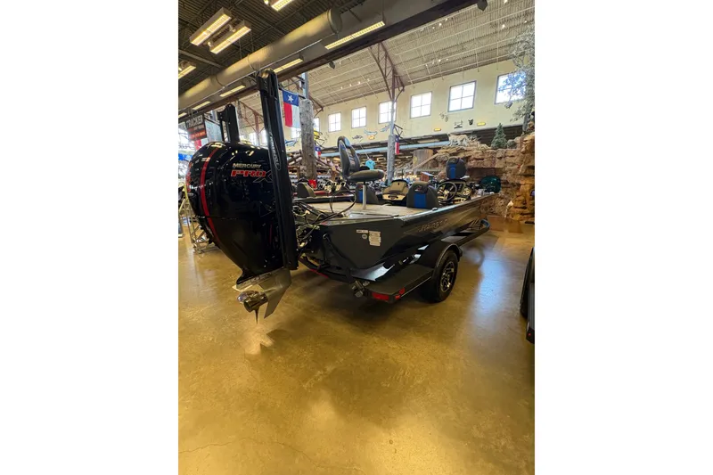 Slide: The Image of 2026 Ranger RT198P boat with Mercury Pro XS engine displayed indoors. - 3
