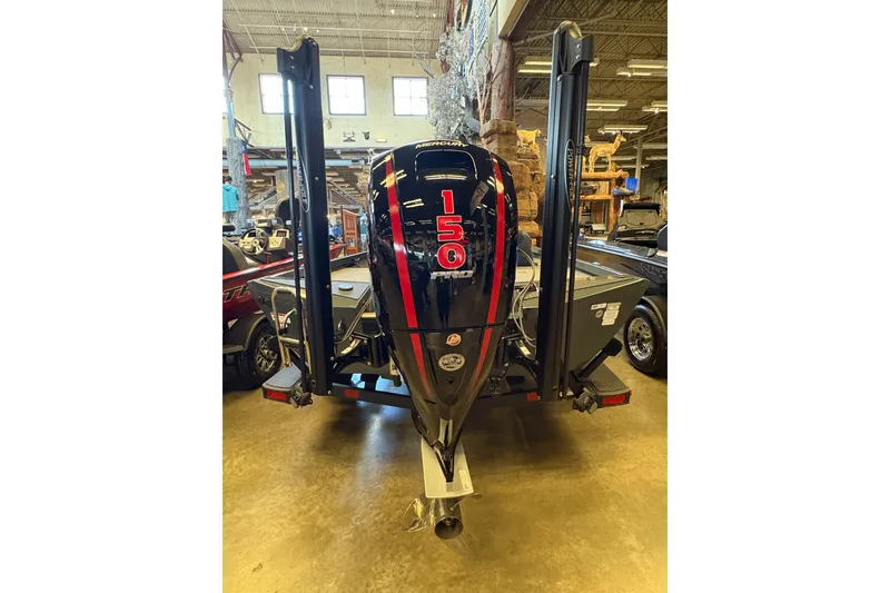 Slide: The Image of 2026 Ranger RT198P boat with powerful 150 HP engine displayed indoors. - 4